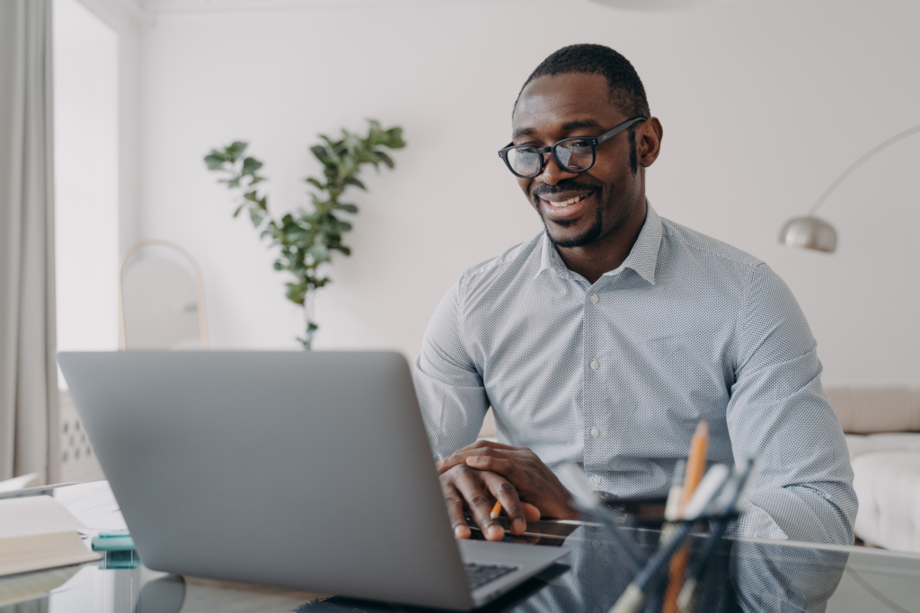 guy looking at mlm software